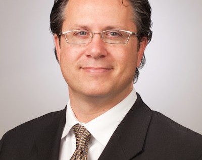 Mark E. Howshar, M.D.